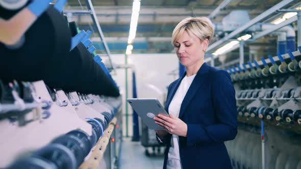 Female Inspector is Supervising a Sewing Machinery Complex