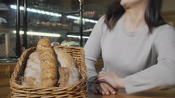 Happy Young Woman Smiling To the Camera After Smelling Aromatic Fresh Bread