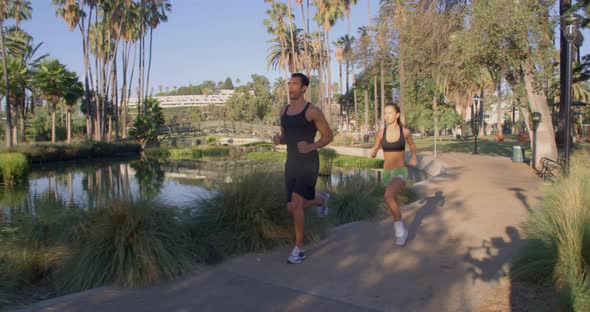 Athlete Couple Jogging In The Park