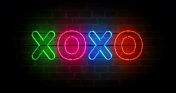 XOXO symbol neon on brick wall loop