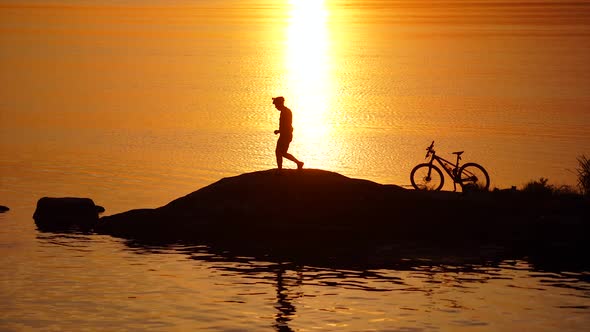 Silhouette of young and active sportsman