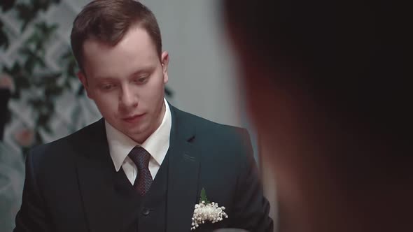 Young Man Talking While Sitting at a Table in a Restaurant Closeup