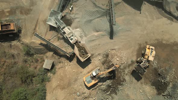 Aerial View Huge Excavator Loading Ground at Quarry