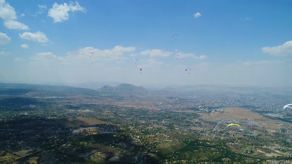 Paragliders Over City