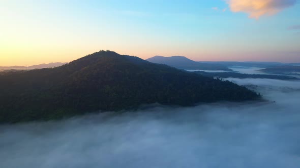 4K Drone Flying through the clouds at dusk or dawn. Aerial top cloudscape