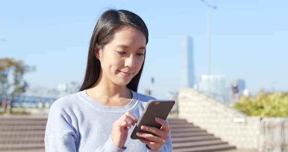 Woman use of mobile phone at outdoor