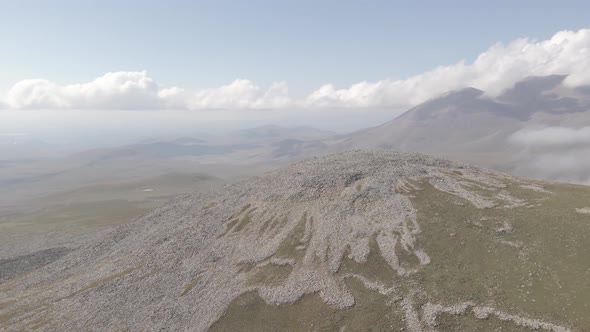 Scenic aerial view of moving white clouds at Abuli Mountain. Georgia