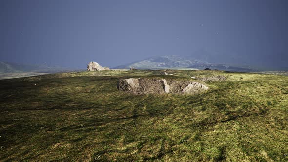 Big Sand Stone and Green Grass Hill Background