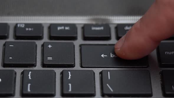 Backspace Button Pressing a Lot of Times on Keyboard Laptop Keyboard Close Up