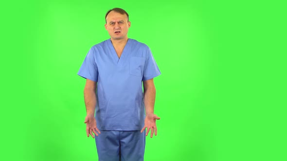 Medical Man Says Wow in Disgust, Negatively Waving His Head. Green Screen