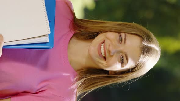 Vertical Screen Students Portrait with Notebooks Outside