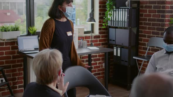 Desperate Woman with Face Mask Explaining Anger Management Issues to Therapist at Aa Meeting