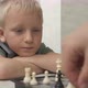 Brother and Sister Playing Chess at Home - VideoHive Item for Sale