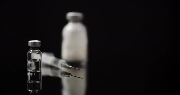 Syringe and Medicine on Black Background Isolated