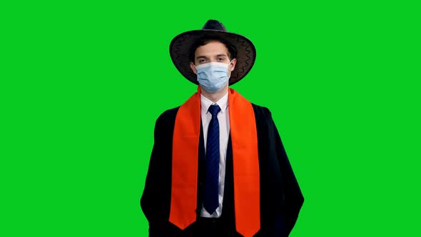 American Graduating Student In Cowboy Hat Walking And Showing Diploma