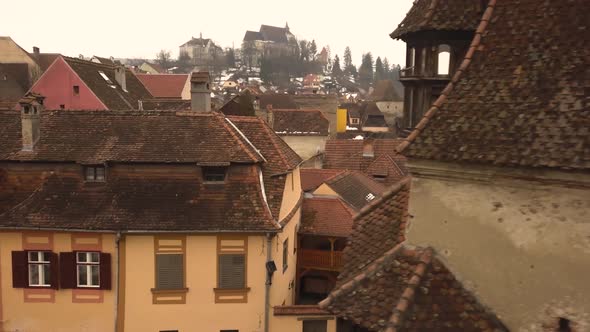 Beautiful view of the roof tops with some snow of the houses and other medieval buildings of Sighiso