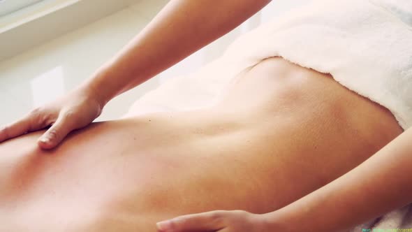 Woman Gets Back Massage Spa By Massage Therapist