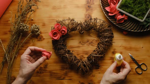 Female Hands Makes Valentines Day DIY Decoration