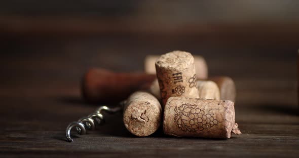 The Wine Corks on the Table Are Slowly Rotating. On a Wooden Background. 