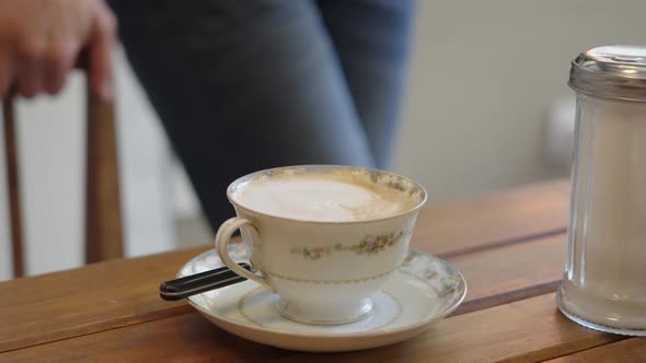 Pouring a cup of caffe latte