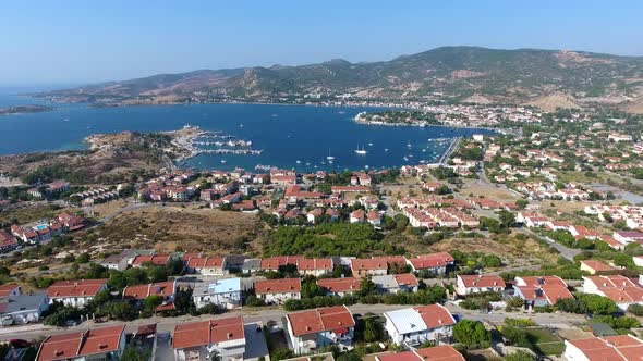 Small City Houses, Beautiful Marina and Touristic Boats in a Bay by Sea