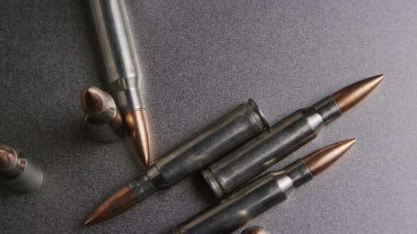 Cinematic Rotating Shot of Bullets on A Metallic Surface