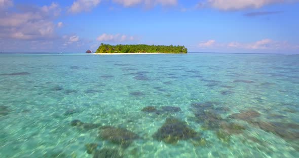 Aerial drone view of a scenic tropical island in the Maldives.