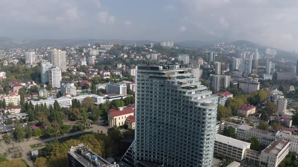 Glass Highrise Building on Cityscape Background From Drone Above