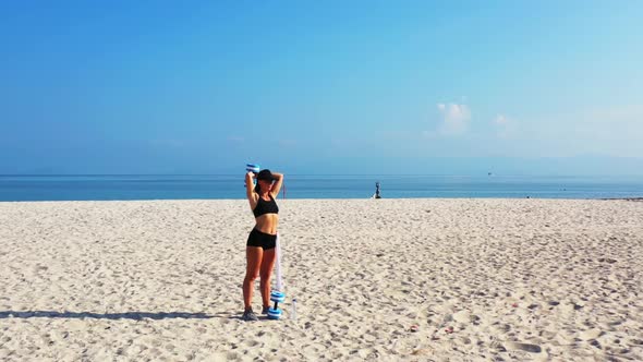 Ladies look beautiful on tropical coastline beach voyage by aqua blue sea with clean sand background