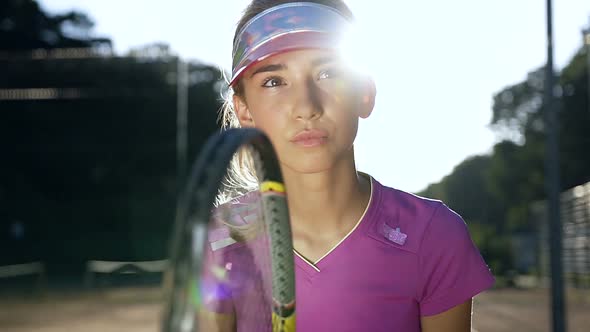 Portrait of Female Beautiful Tennis Player Concentrating and Focusing