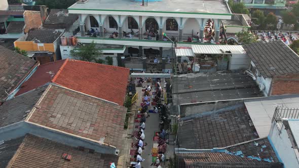 Aerial View of People offering prayers on the Eid morning at famous mosque Jama Masjid in Bekasi.