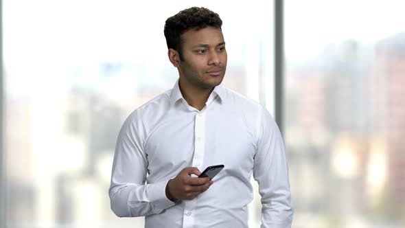 Young Indian Businessman Taking Photo with Smartphone.