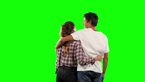 Rear view of a couple with green screen