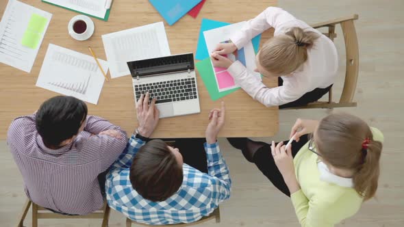 Group of multiethnic busy people working in an office, top view