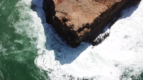 AERIAL CLOSEUP of coastal erosion on the Great Ocean Road, Australia