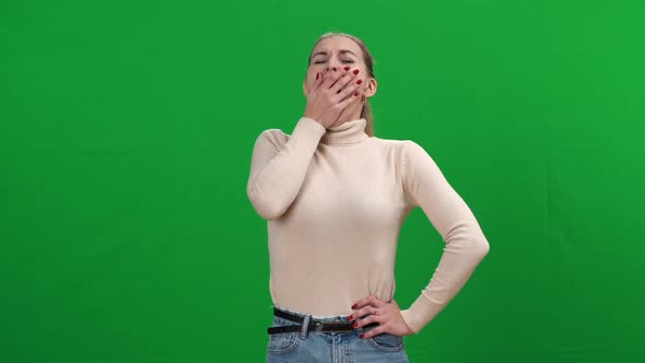 Exhausted Young Woman Yawning at Chromakey Background