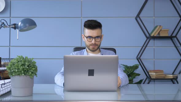 Young Man in Fashion Glasses Eye Looking Monitor, Surfing Internet. Stylish Male Working