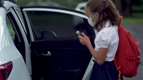 Cute Pupils Using Smartphones at the Elementary School