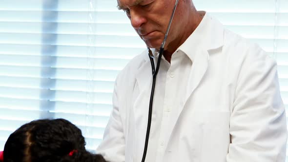 Male doctor examining a patient