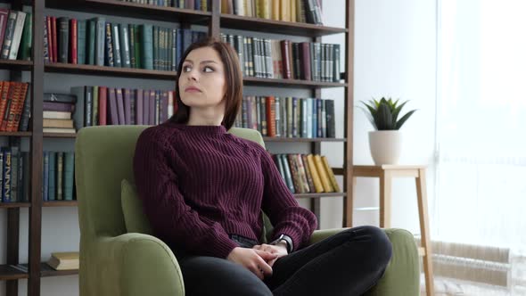 Woman Waiting in Office Checking Time on Smartwatch