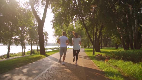 Young Sporty Couple Jogging in Morning