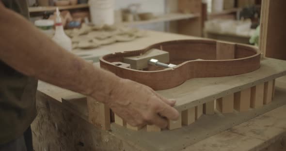 guitar mold being placed on the counter