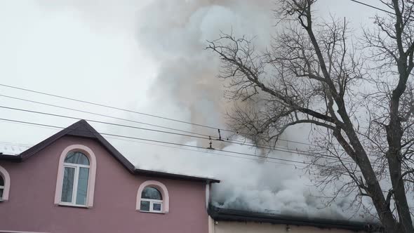 Burning Roof with Heavy Smoke in Residential House