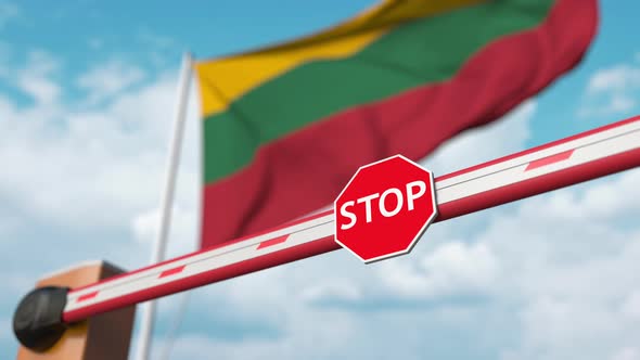 Opening Barrier with Stop Sign Against the Lithuanian Flag