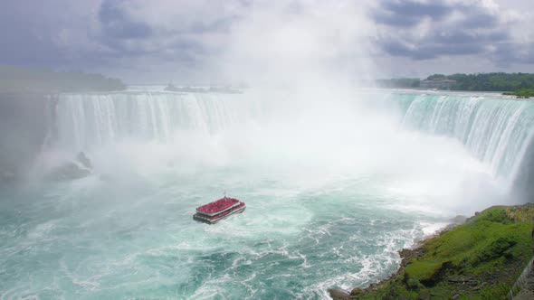 Close-up View of the Powerful Raging Whitewater Waterfall Falling Forcefully Over a Rocky Edge