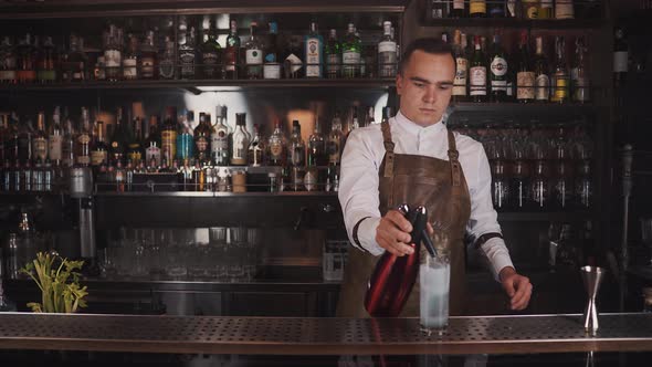 The Bartender Makes a Cocktail