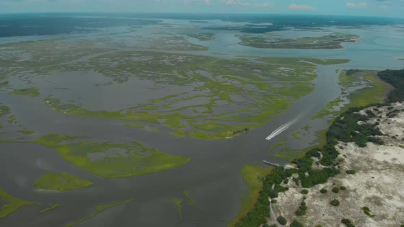 drone shots of the sand dunes and marsh lands at the coast