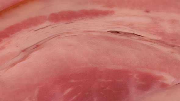 Macro shot of boiled ham slice, close up view in 4k. Healthy fat and protein source.