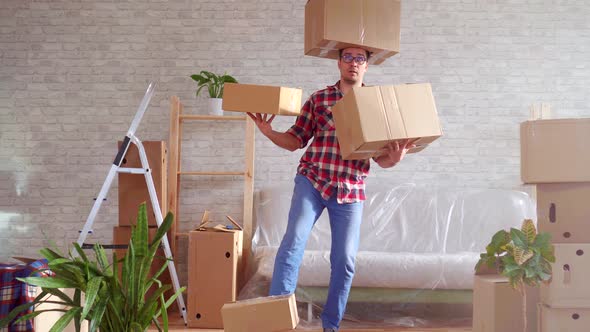 Man in Glasses and Shirt with Boxes on His Head Hands and Feet