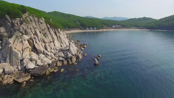 Drone View of the Beautiful Sea Rocky Coast with Clear Blue Water
